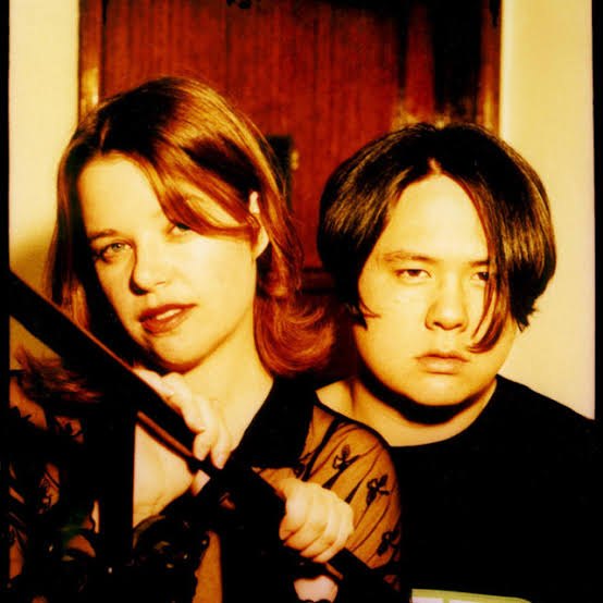 Suzanne Perry and Ryan Lum of Love Spirals Downwards in a 1990s portrait